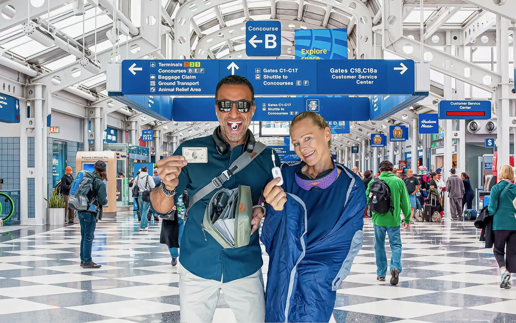 Phil and Erin Lockwood display their favorite travel gear in the middle of O'Hare terminal