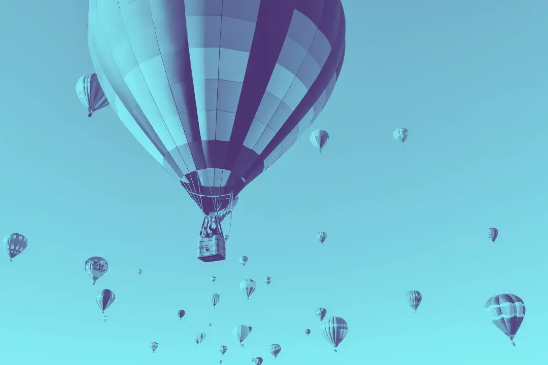 photo of several hot air balloons in flight