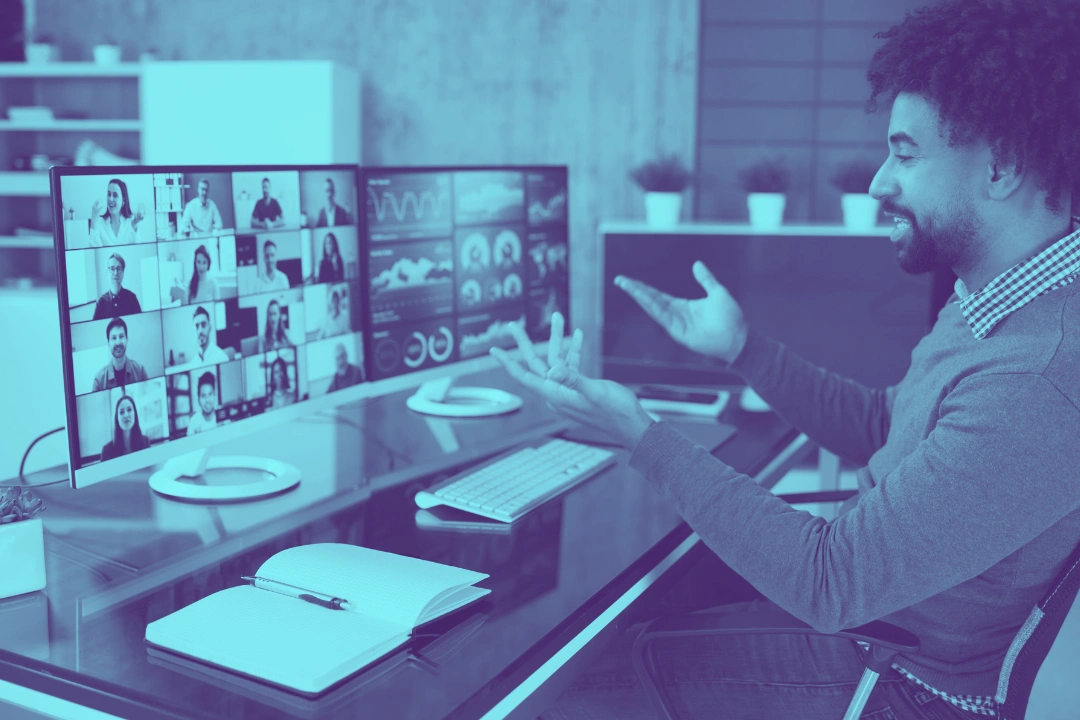 photo of a man having an online meeting with several colleagues