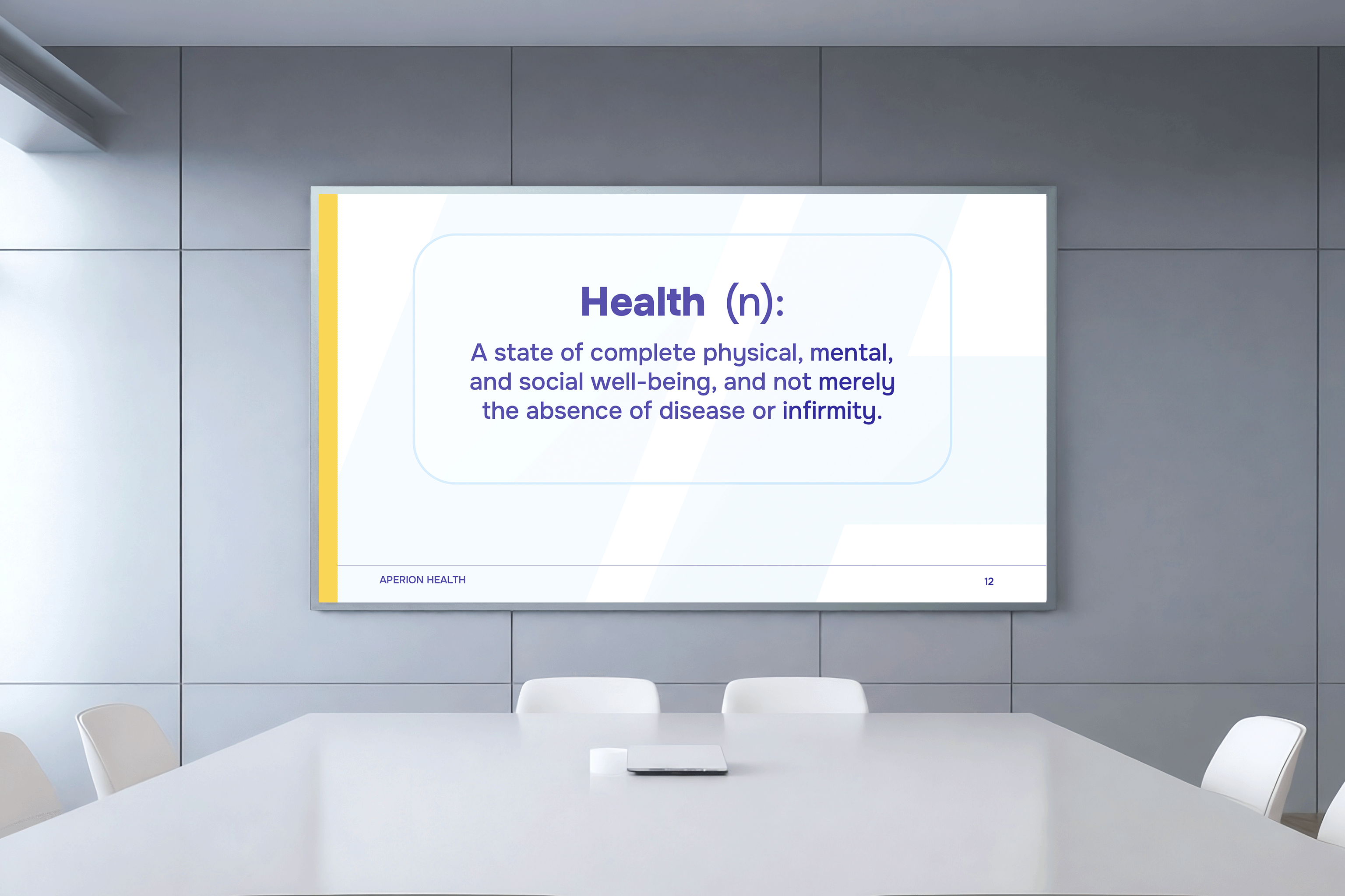 Conference room screen showing definition of health as complete physical, mental, and social well-being.