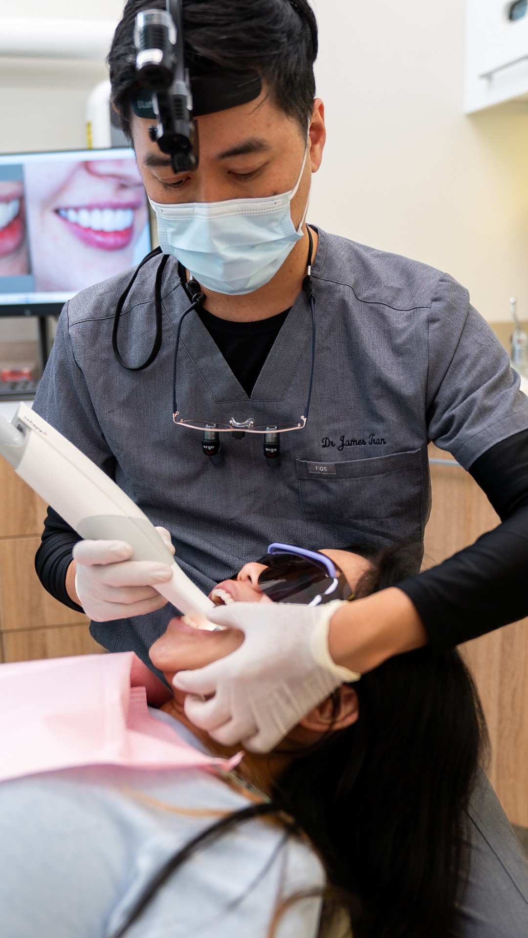 Dr James Tran performing dental scan during general check-up
