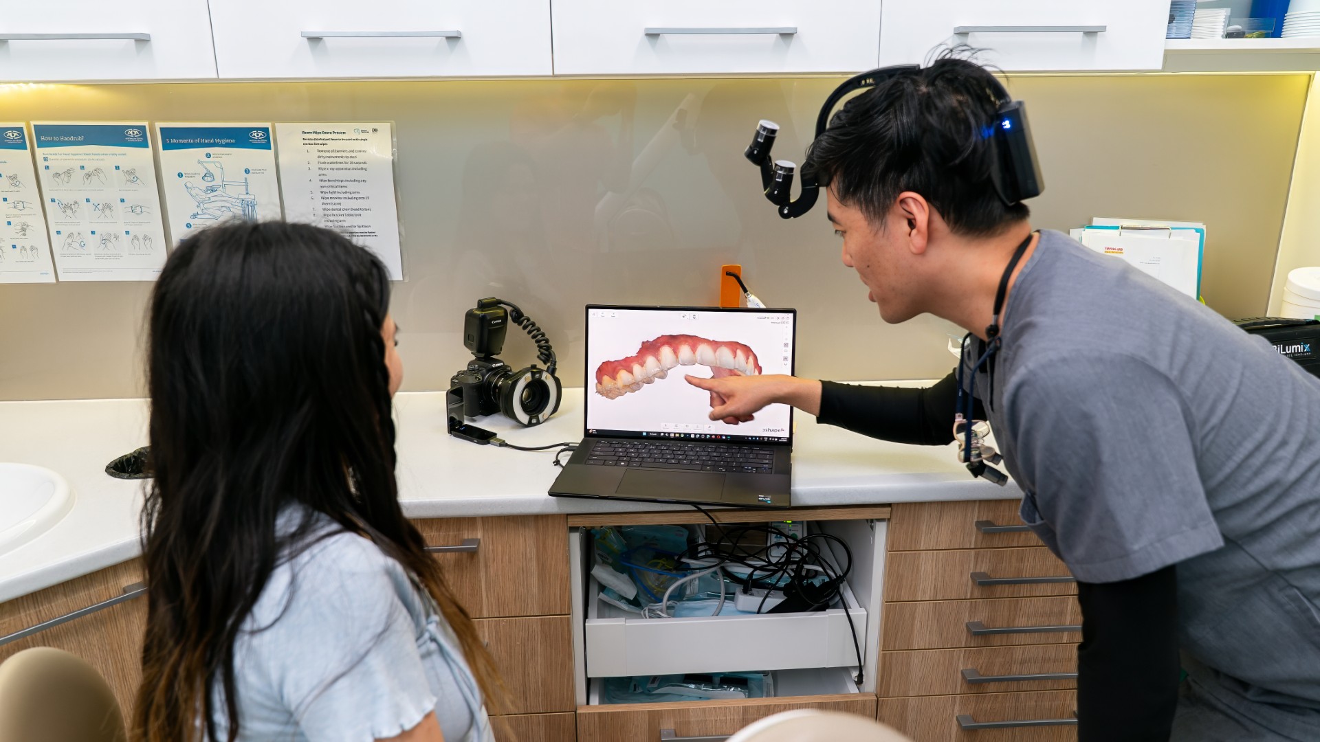 Dr James Tran showing 3D digital scan on laptop for aligner treatment planning