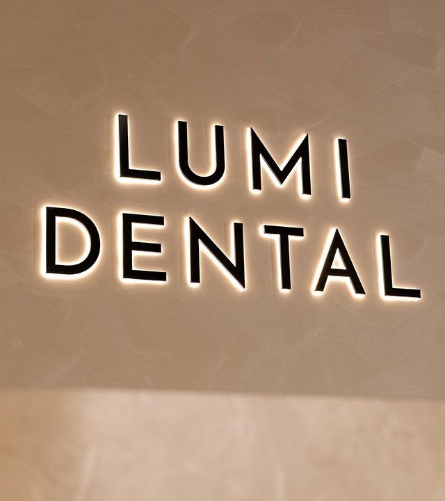 The Lumi Dental sign on the reception wall