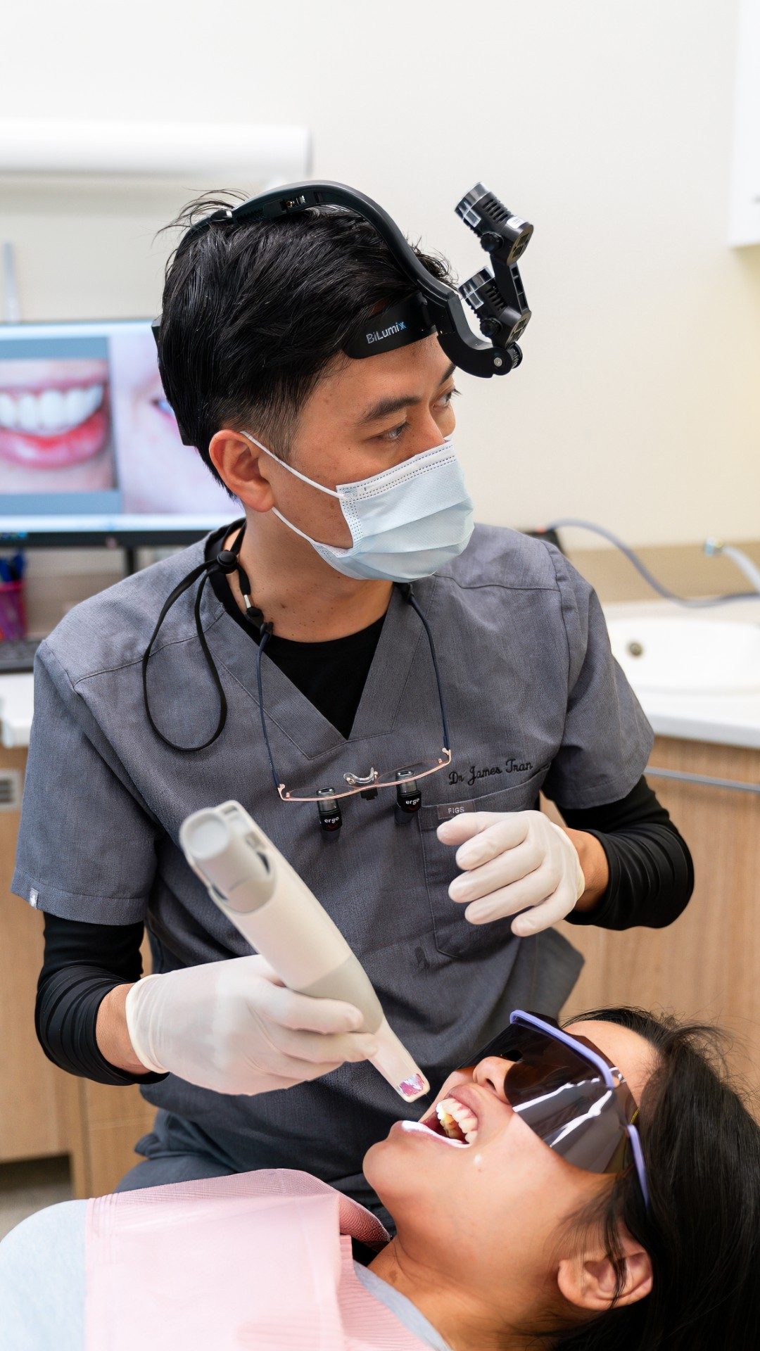 Dr James Tran taking a 3D scan of a patient's teeth