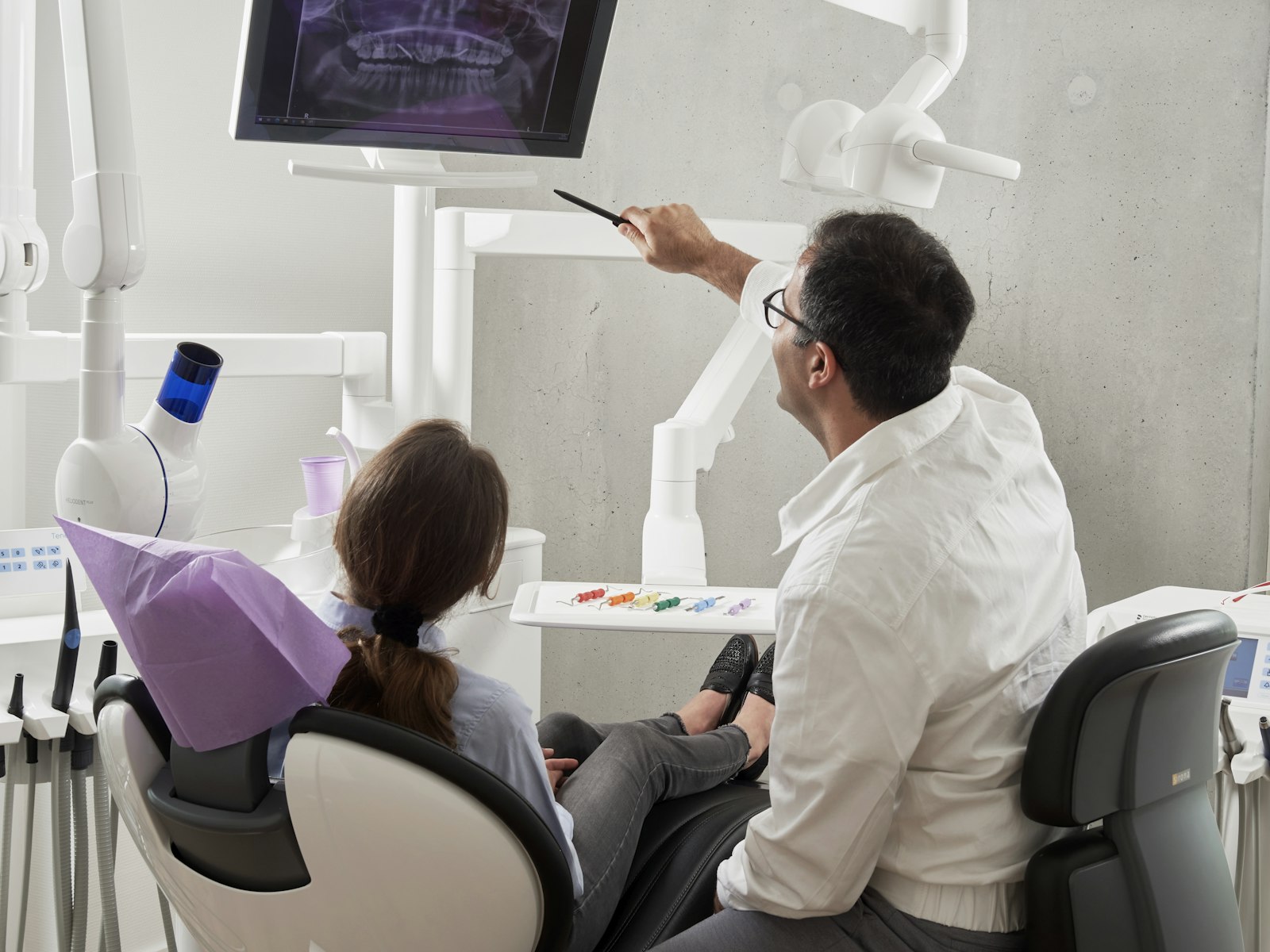 Sydney dentist reviewing dental X-rays with a patient during a gum disease consultation