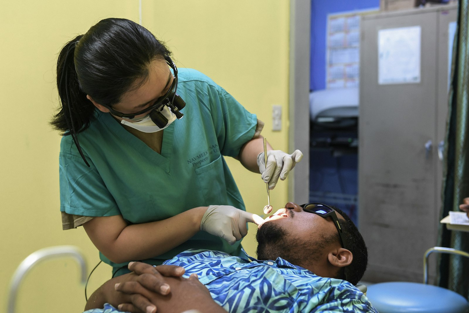 Dentist reviewing dental X-rays with a patient in Sydney