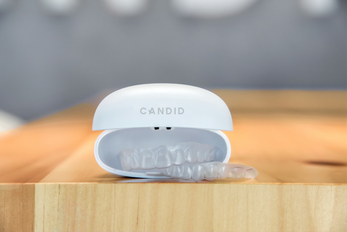 Close-up of a dental appliance on a plain background