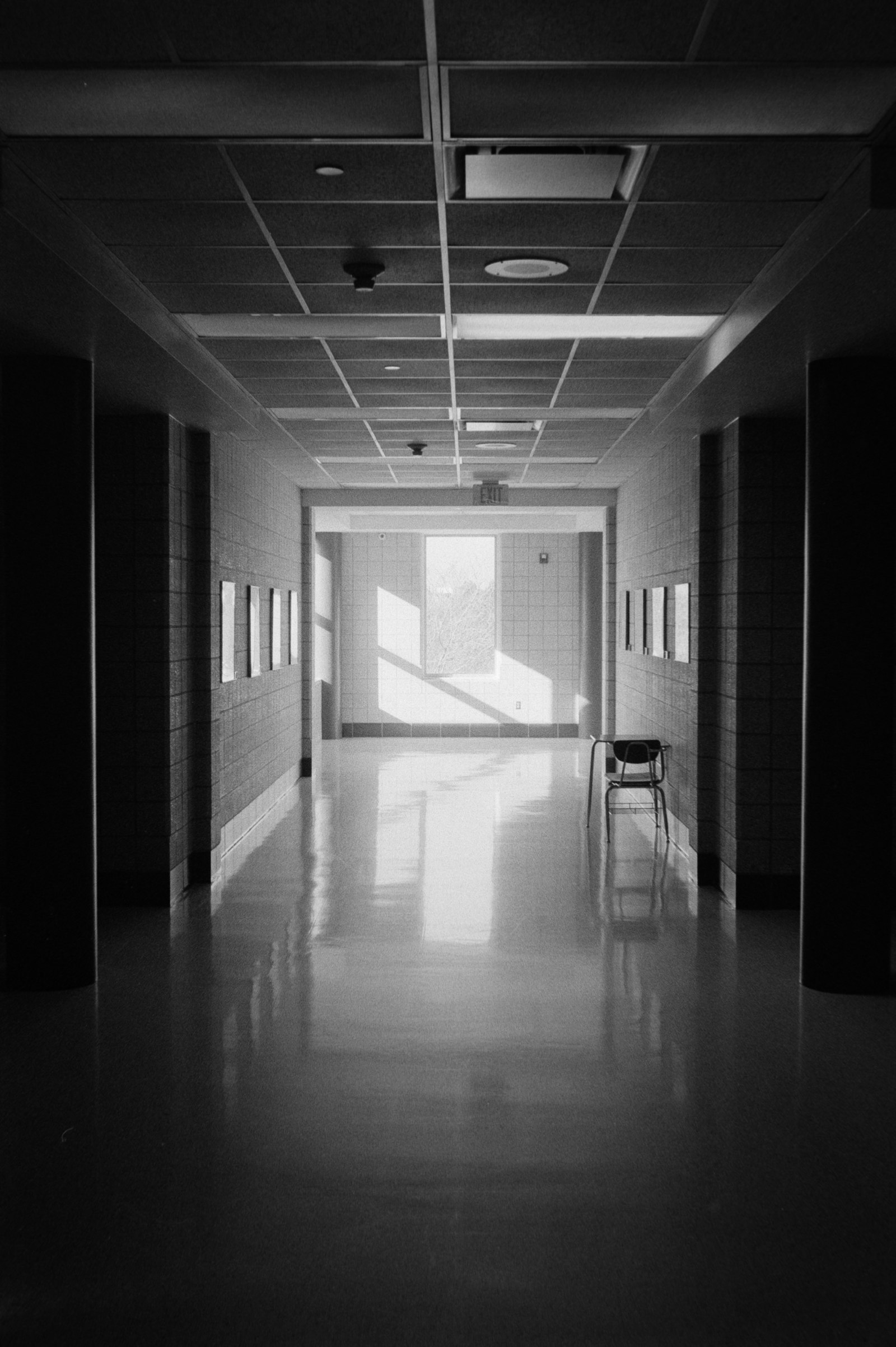 Empty institutional hallway representing the public dental waiting list system in NSW