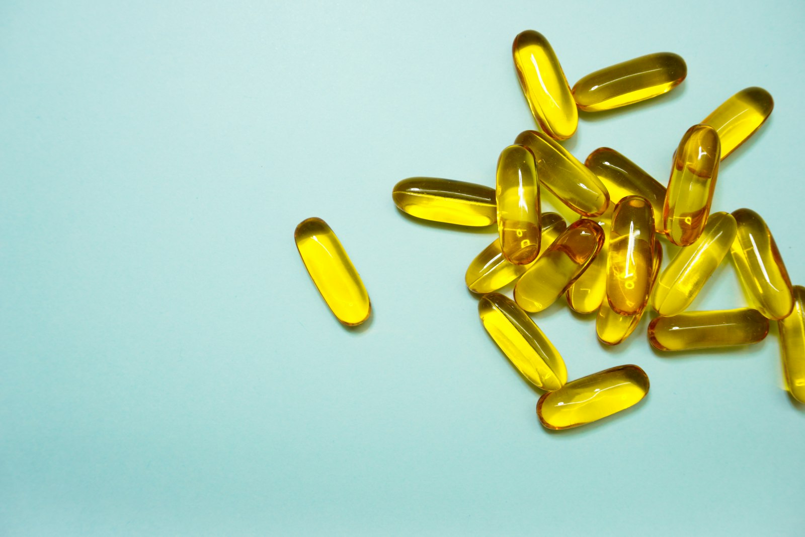 Brown and yellow medication tablets, representing decongestants and cold medicines that may affect your teeth