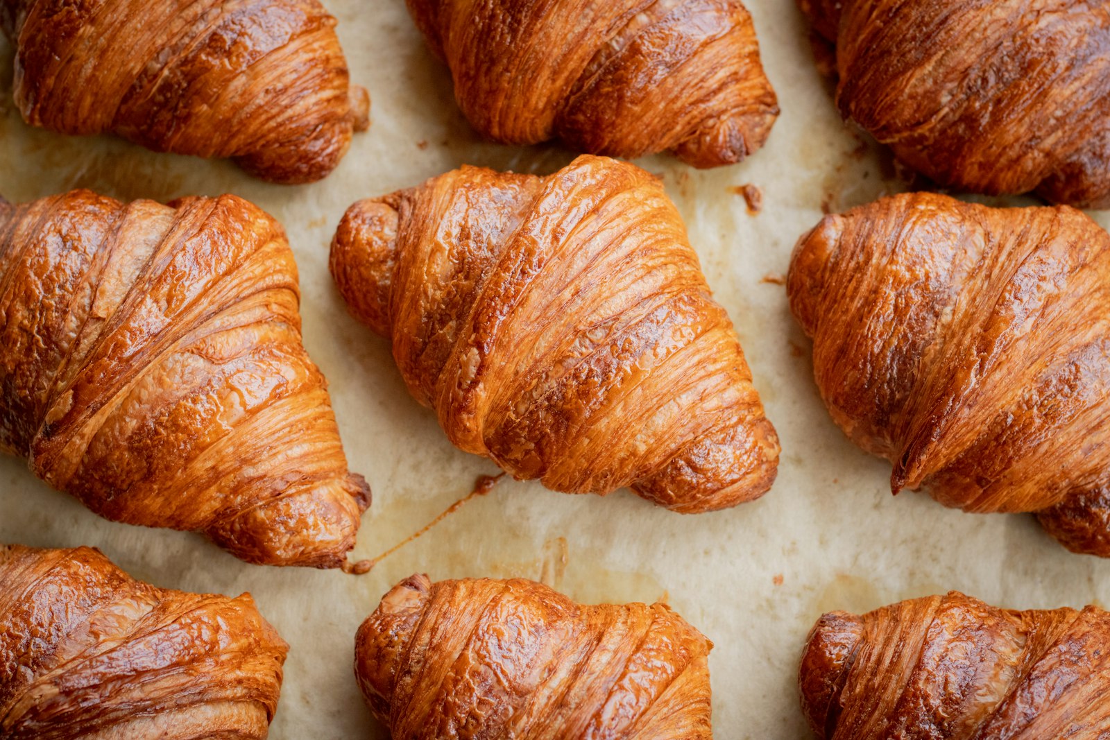 Freshly baked bread and pastries on a bakery counter, relevant to baker's caries and occupational tooth decay