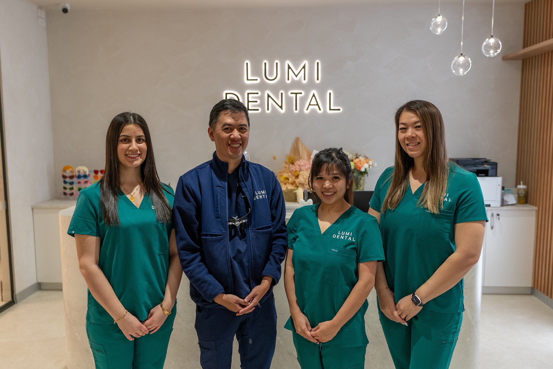 The team at Lumi Dental at reception in Melrose Park