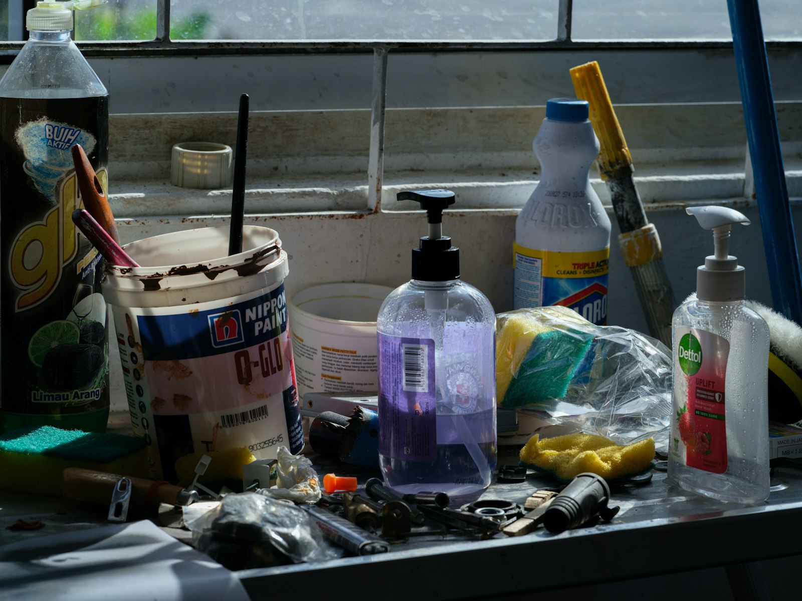 Assorted cleaning supplies and tools arranged on a counter, showing the products commercial cleaners handle each shift