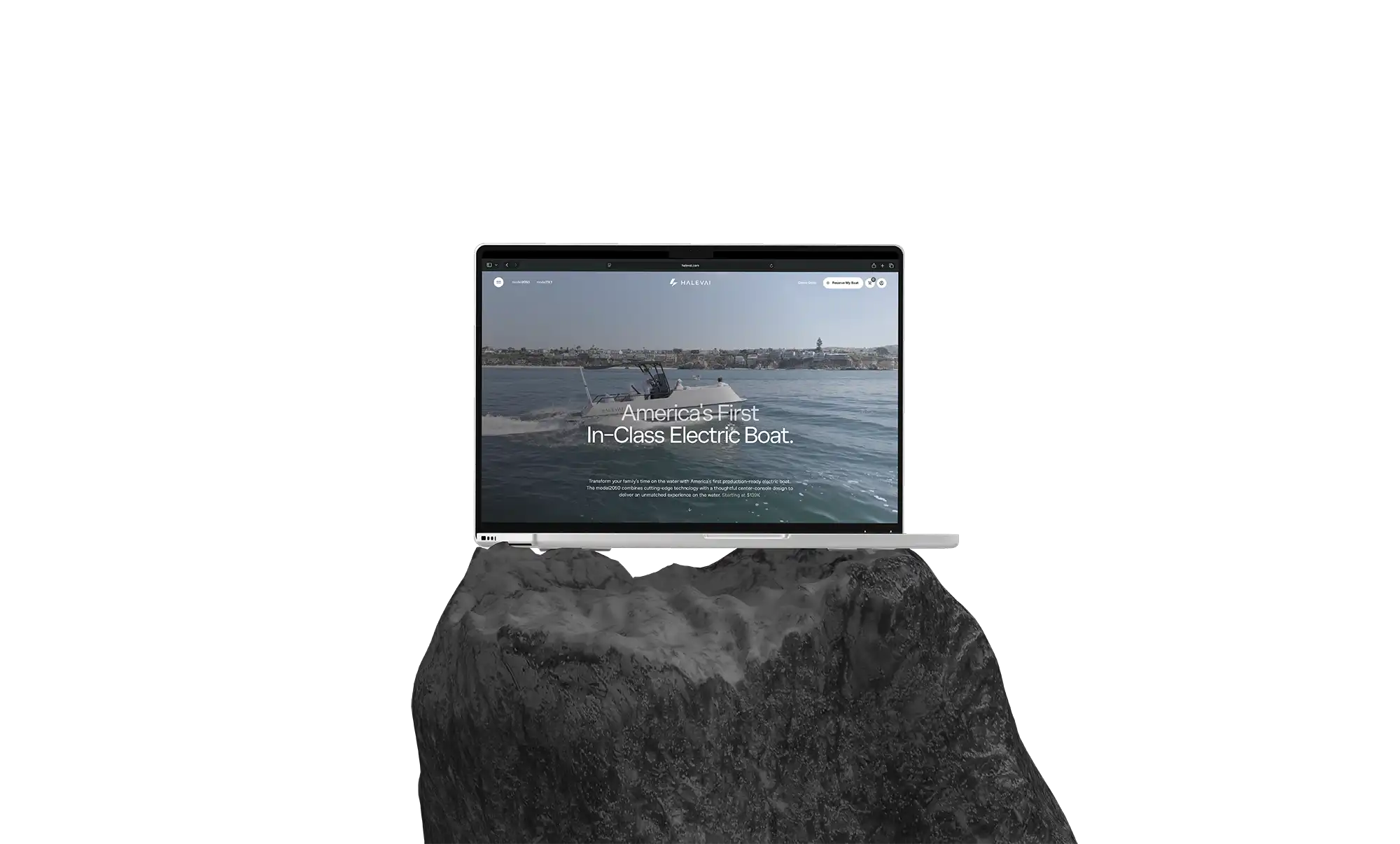 Laptop displaying a website with a video of an electric boat on water and text reading 'America's First In-Class Electric Boat.'