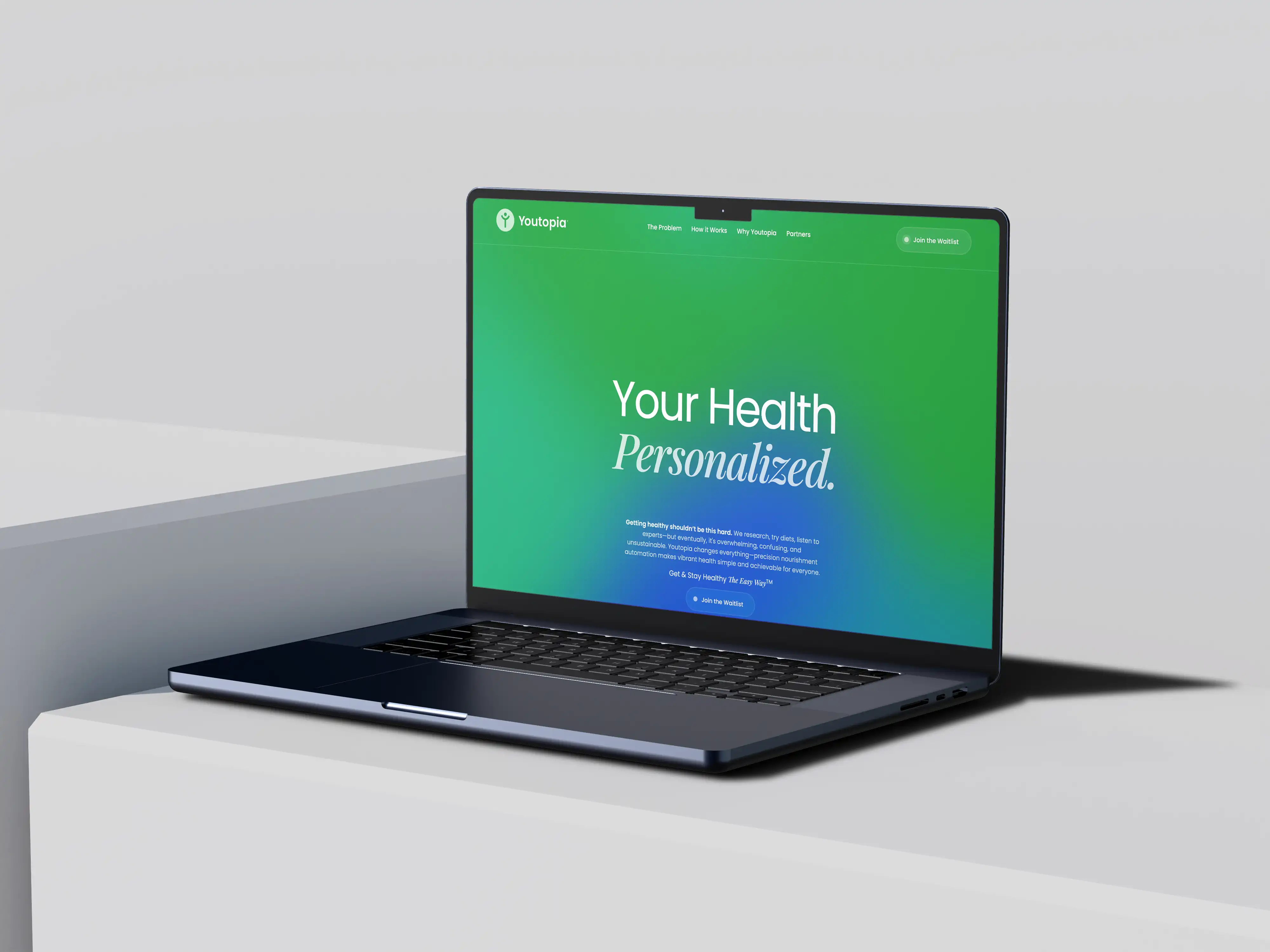 Open laptop on a white surface displaying a green gradient webpage with the header 'Your Health Personalized.'