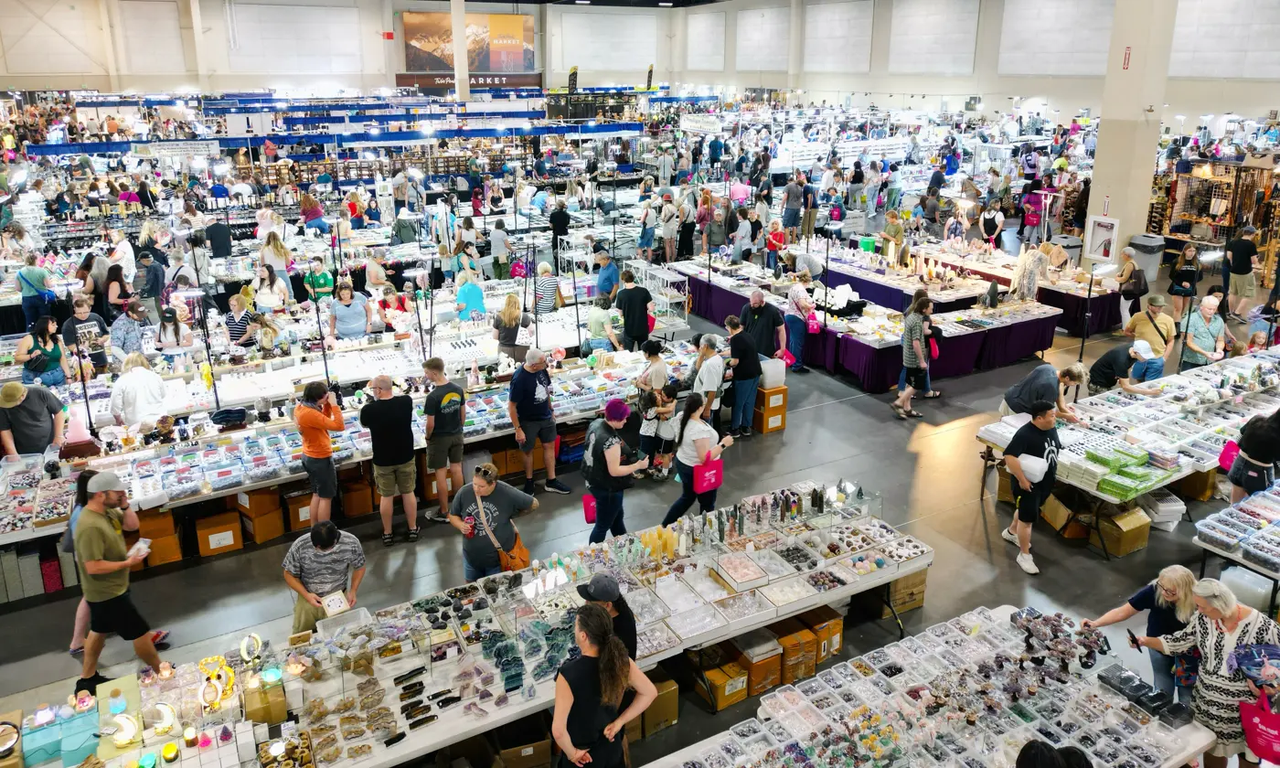 Aerial view of the Gem Faire show floor filled with vendor booths and shoppers