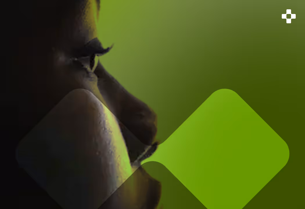 Close-up side view of a person's face with a green geometric overlay on a green background.