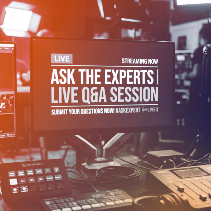 Studio monitor displaying 'Ask the Experts Live Q&A Session' with streaming and submission info in a broadcast setup.
