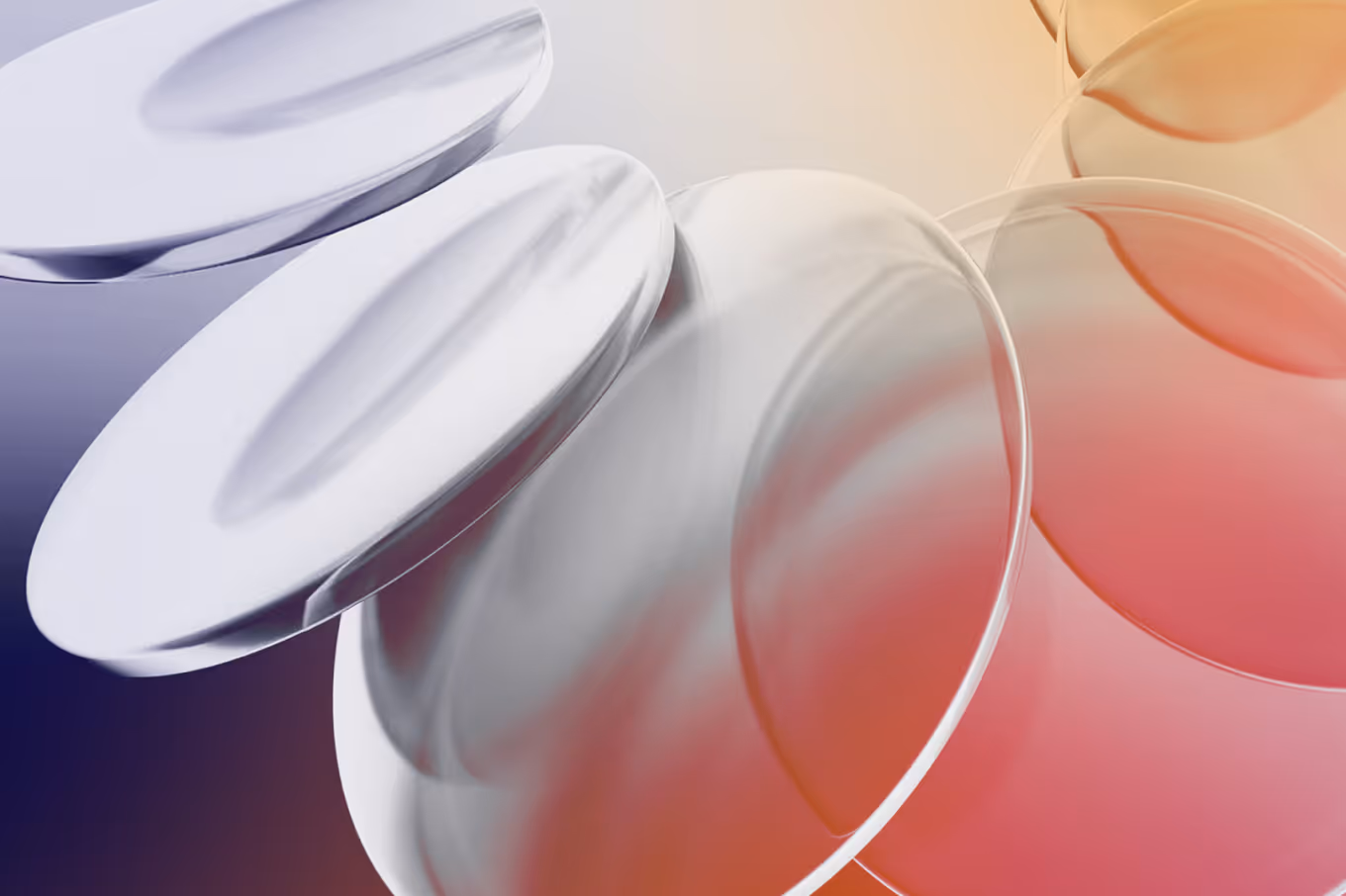 Transparent and white overlapping circular glass discs with a gradient background of purple, orange, and red.