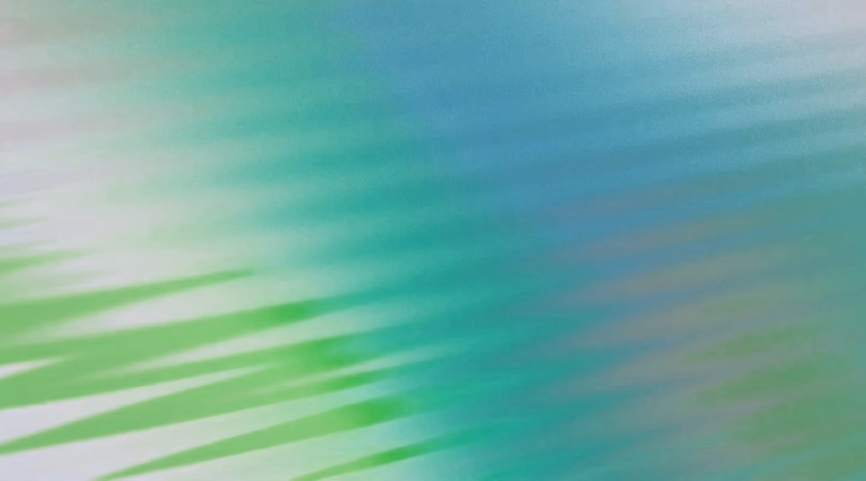 Blurred abstract background with soft gradient shades of green, blue, and hints of beige.