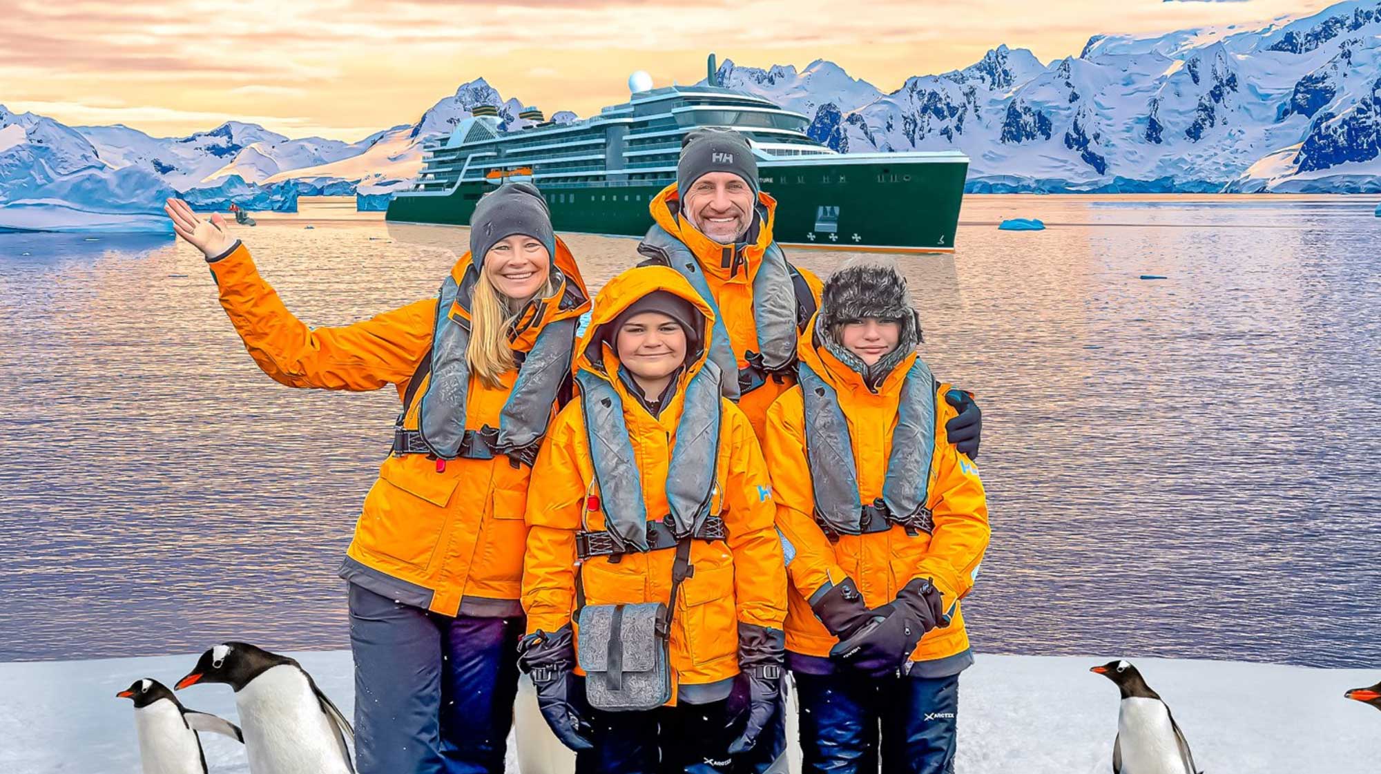 The Lockwood family standing on the shore of Antarctica with a cruise ship in the background
