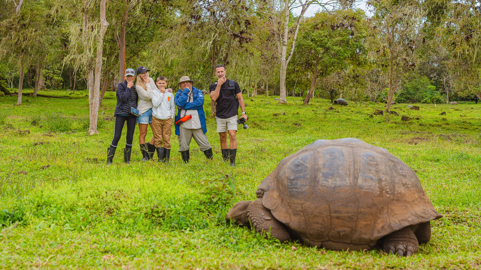 The Lockwood family poses next to a giant tortoise on the Galapagos Islands