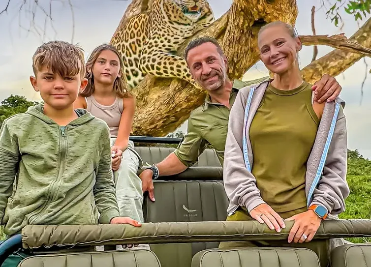 The Lockwood family on a safari jeep with a leopard
