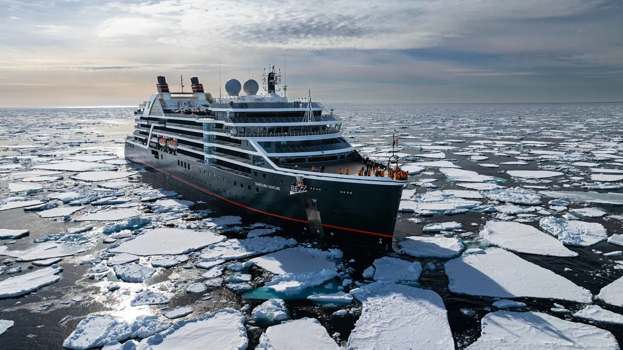 Seabourn Venture cruises through an ice field