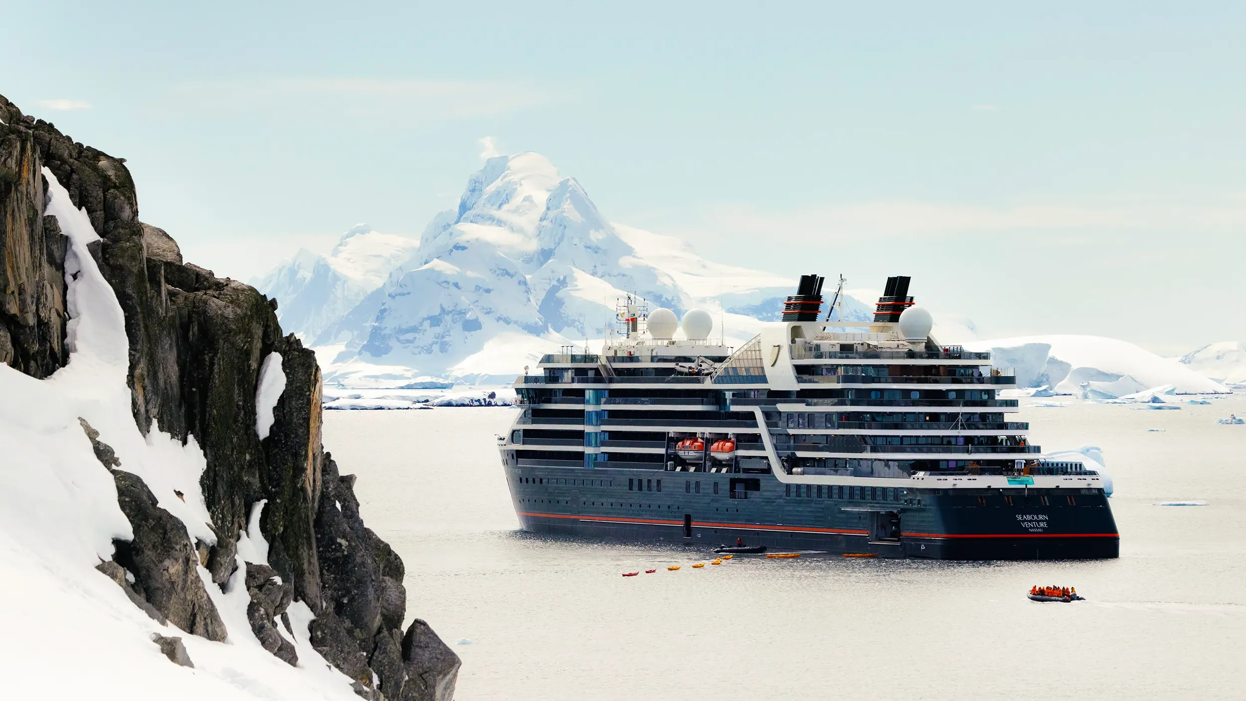A Seabourn expedition cruise ship anchored in an Antarctic harbor
