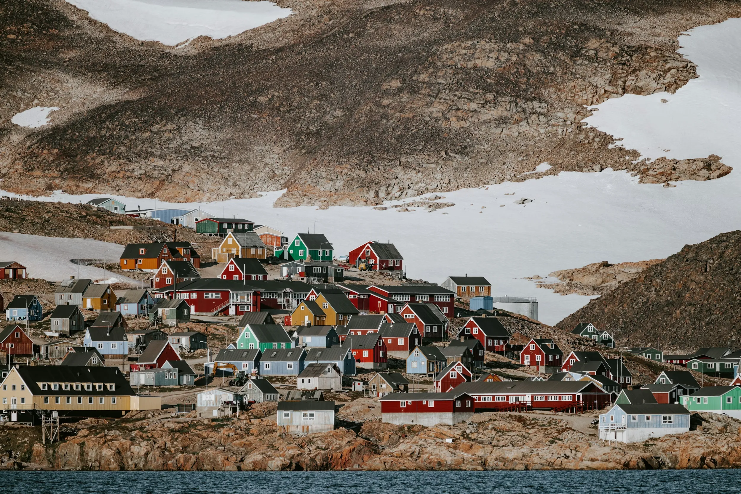 Colorful homes on a hill in Ittoqqortoormiit, Greenland
