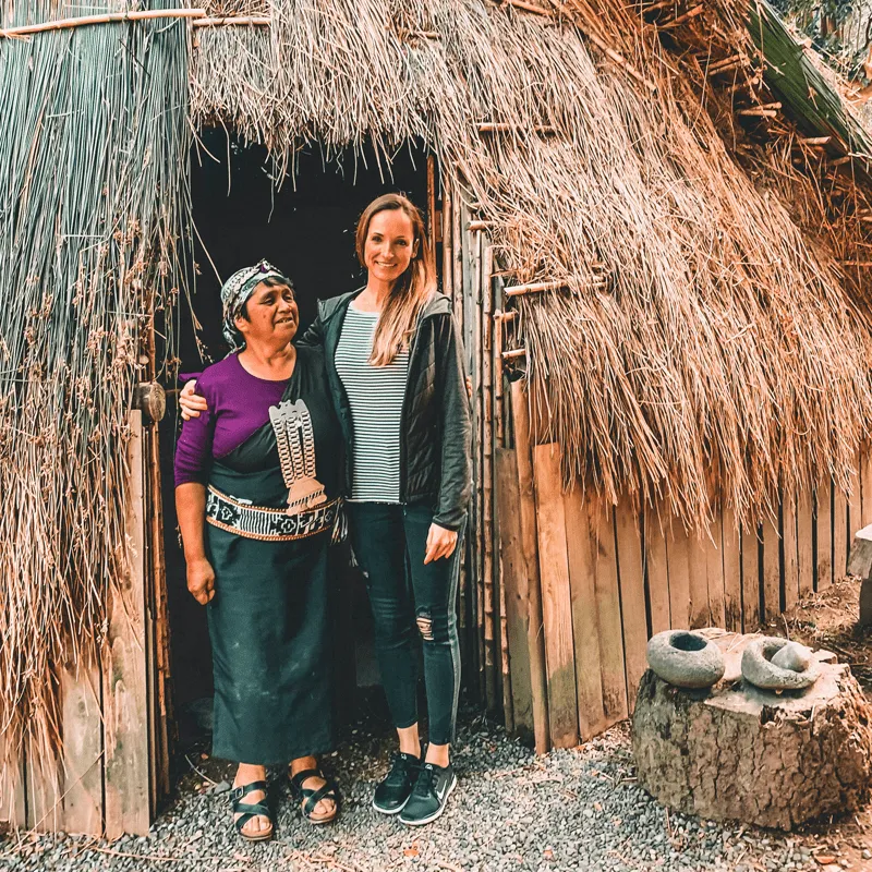 a tourist meets with a Chilean local at a hut