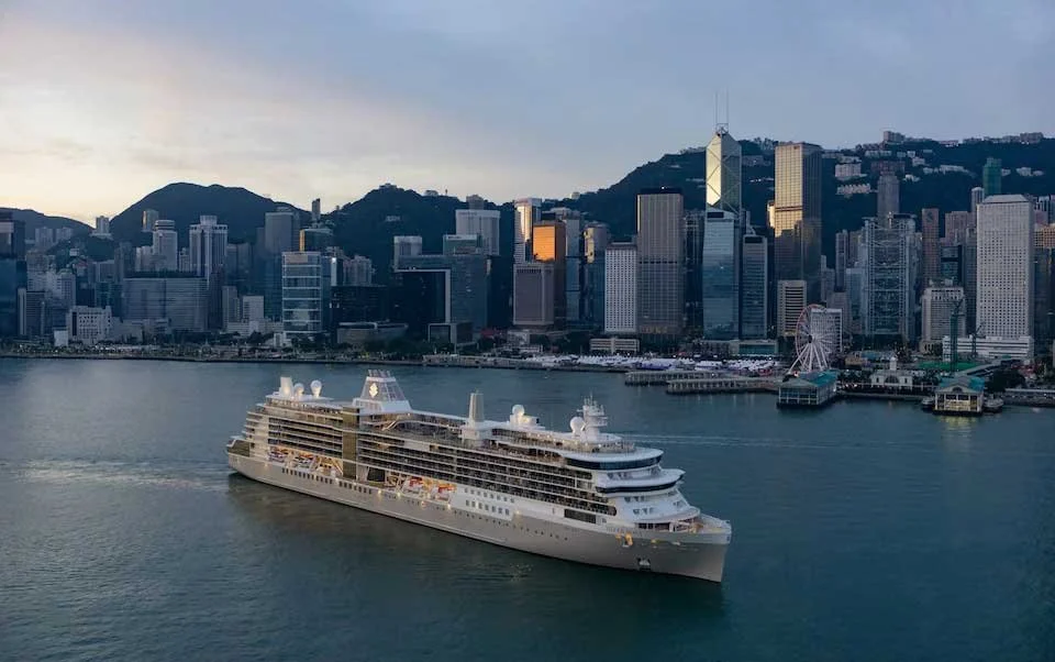 A Silversea cruise ship sails past the Hong Kong skyline