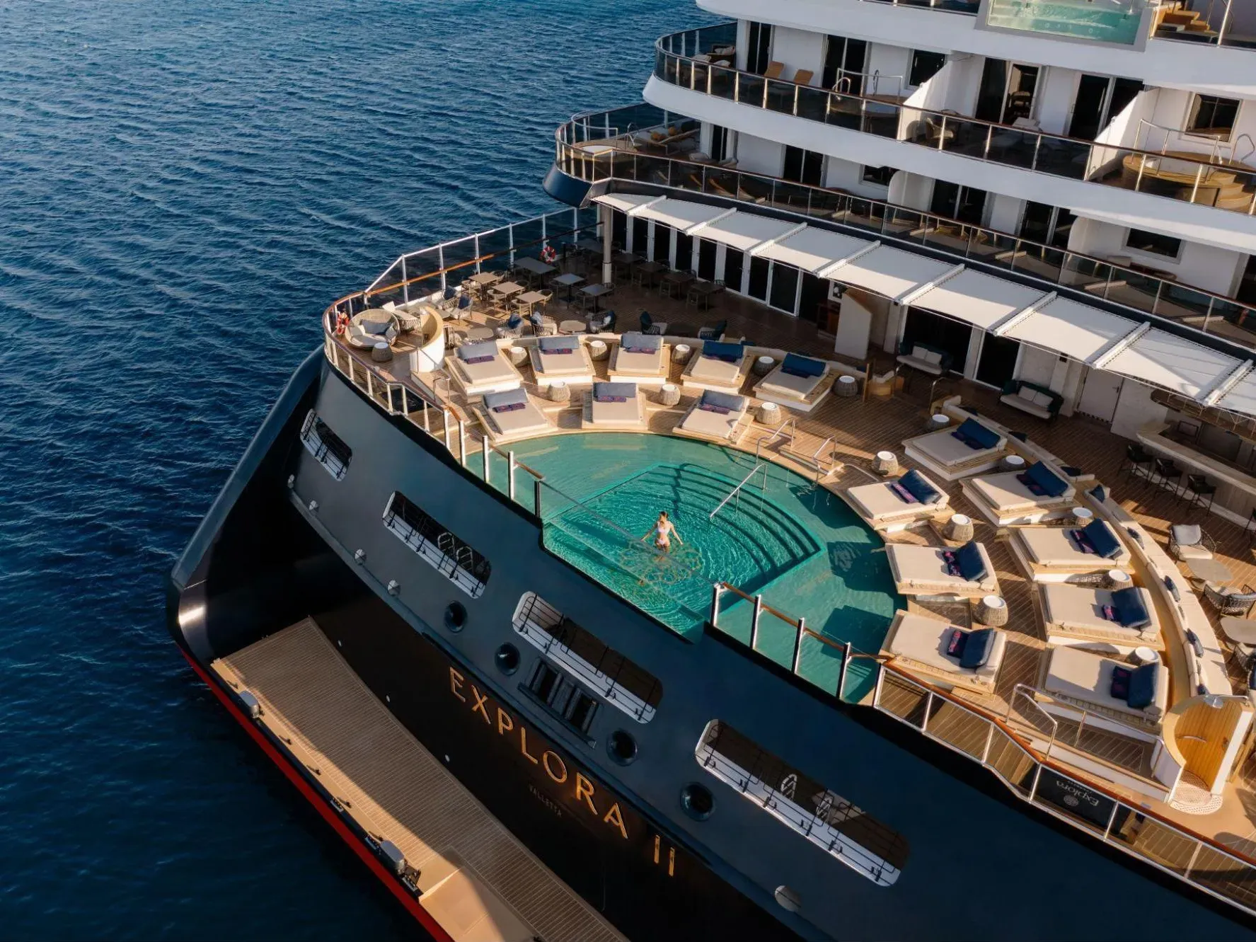 An Explora Journeys cruise ship aft pool deck