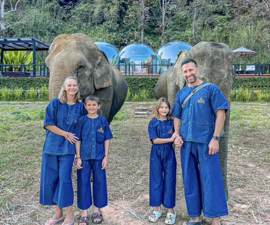 The Lockwood family stands with rescue elephants in Thailand