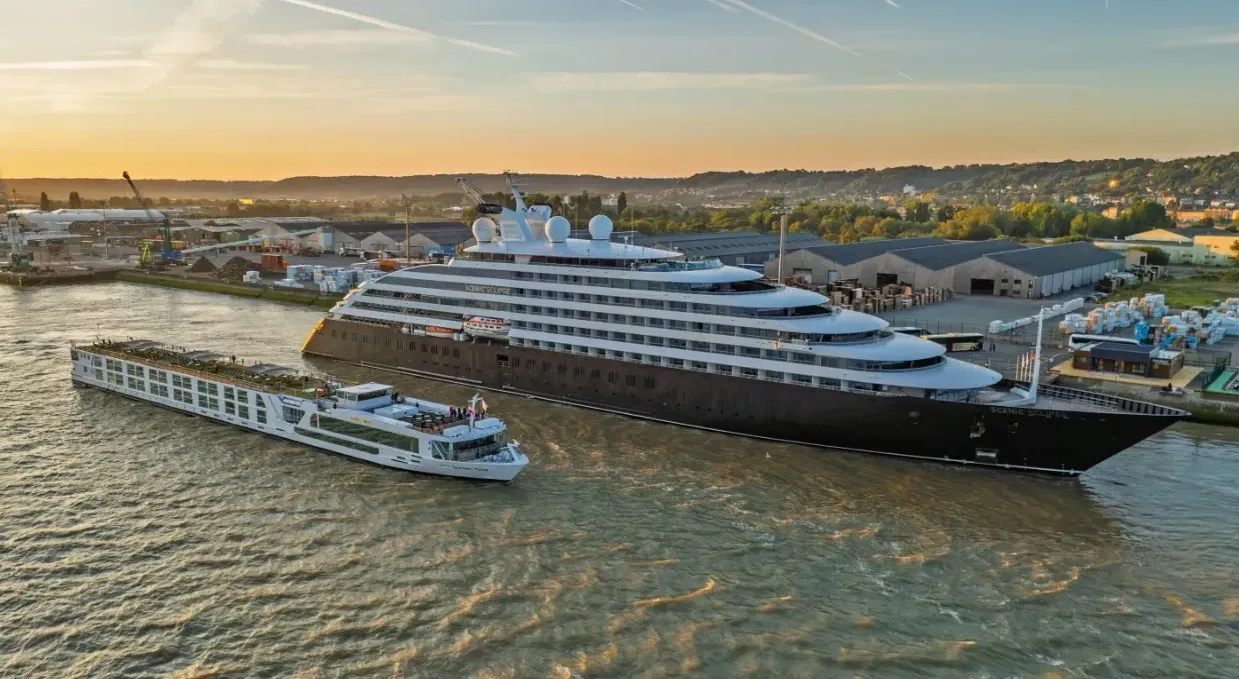 A Scenic yacht next to a Scenic river cruise ship