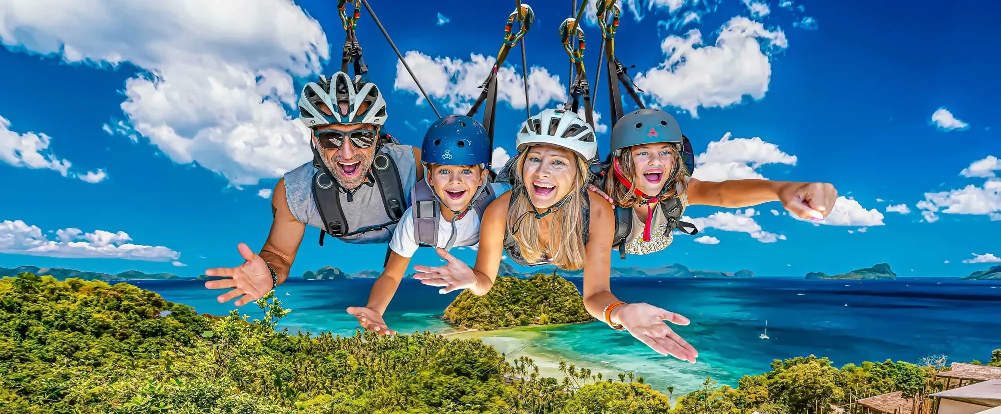 The Lockwood family zip lines over islands in the Philippines