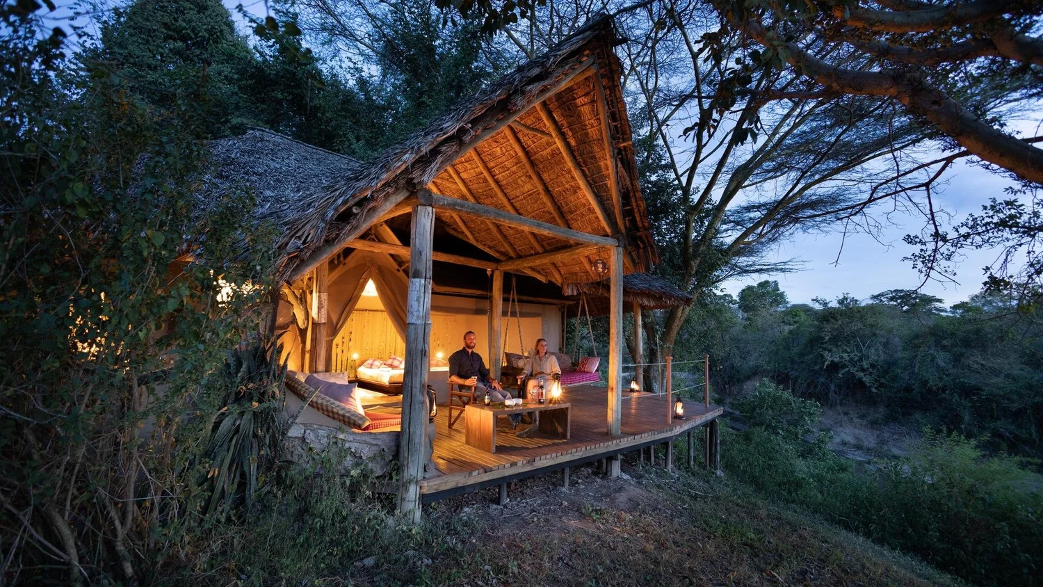 Dusk view of a cabin at Basecamp Masai Mara