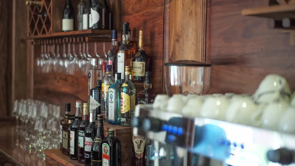 Liquor bottles behind a bar