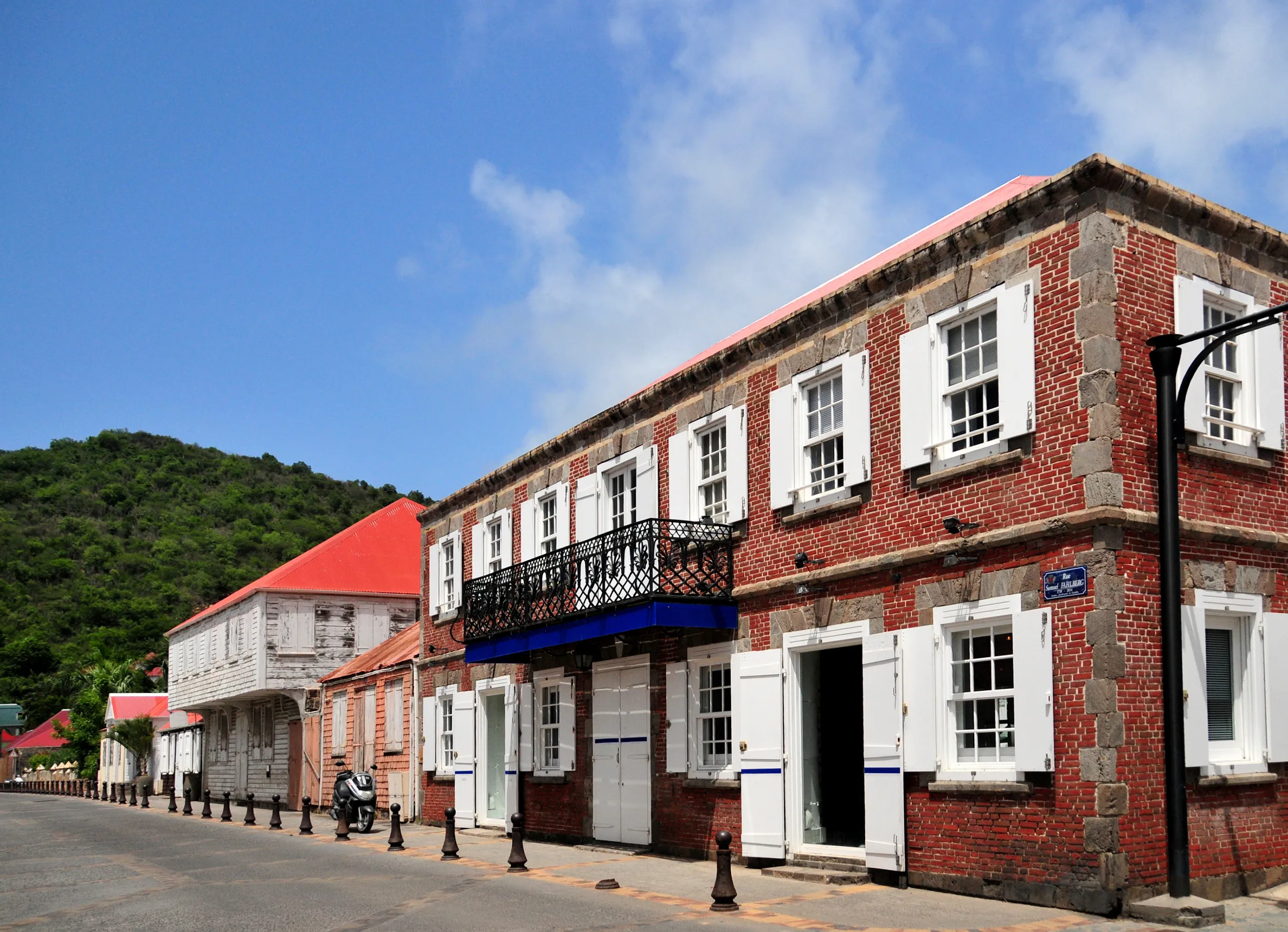 Storefront buildings along a street in the Caribbean