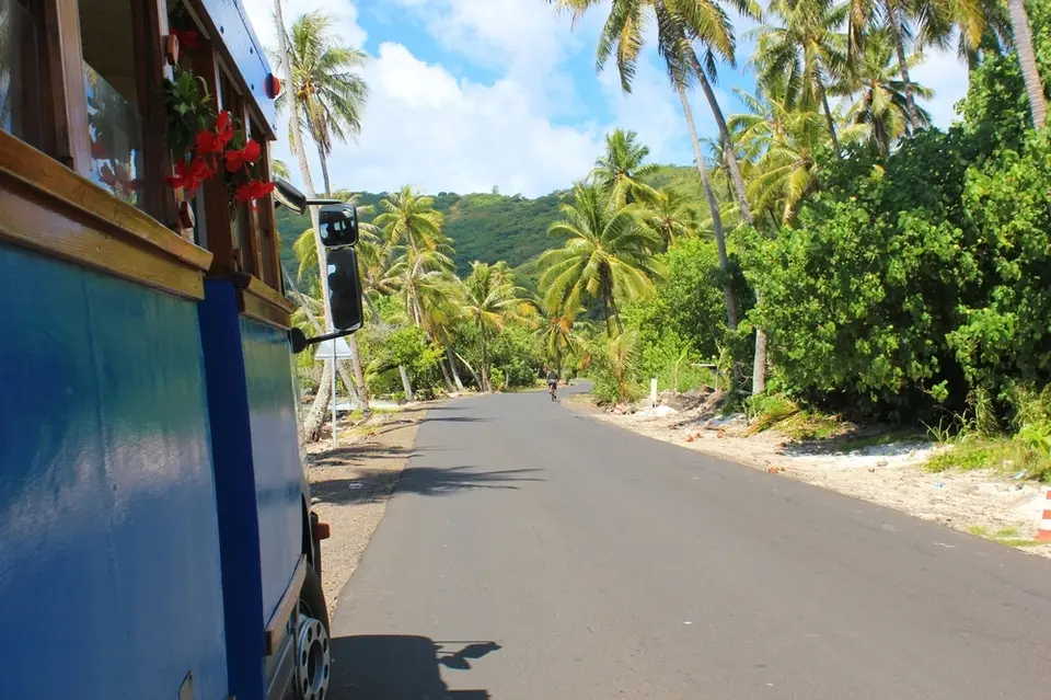 A van drives up a hill in Bora Bora
