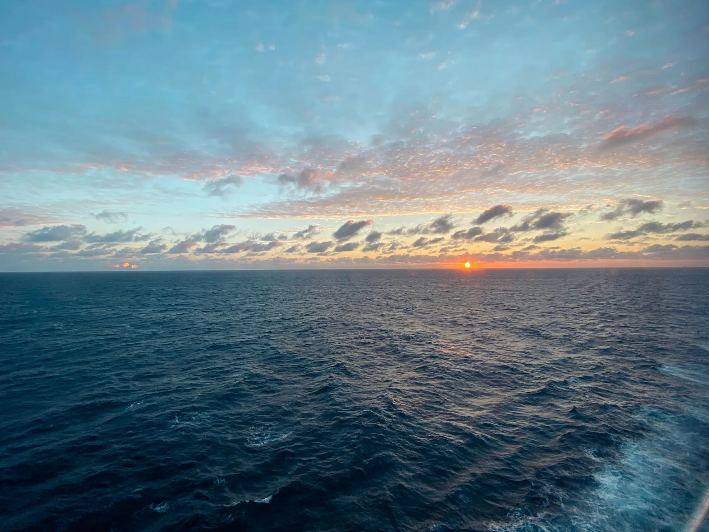 Sunset over blue waters of the South Pacific