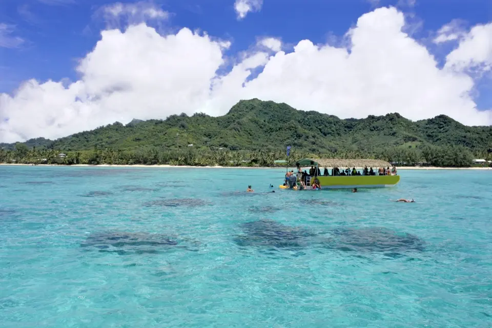 A glass-bottom boat over clear waters in Rarotonga