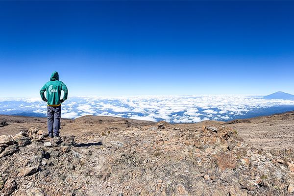 Hiker stands on Kilimanjaro