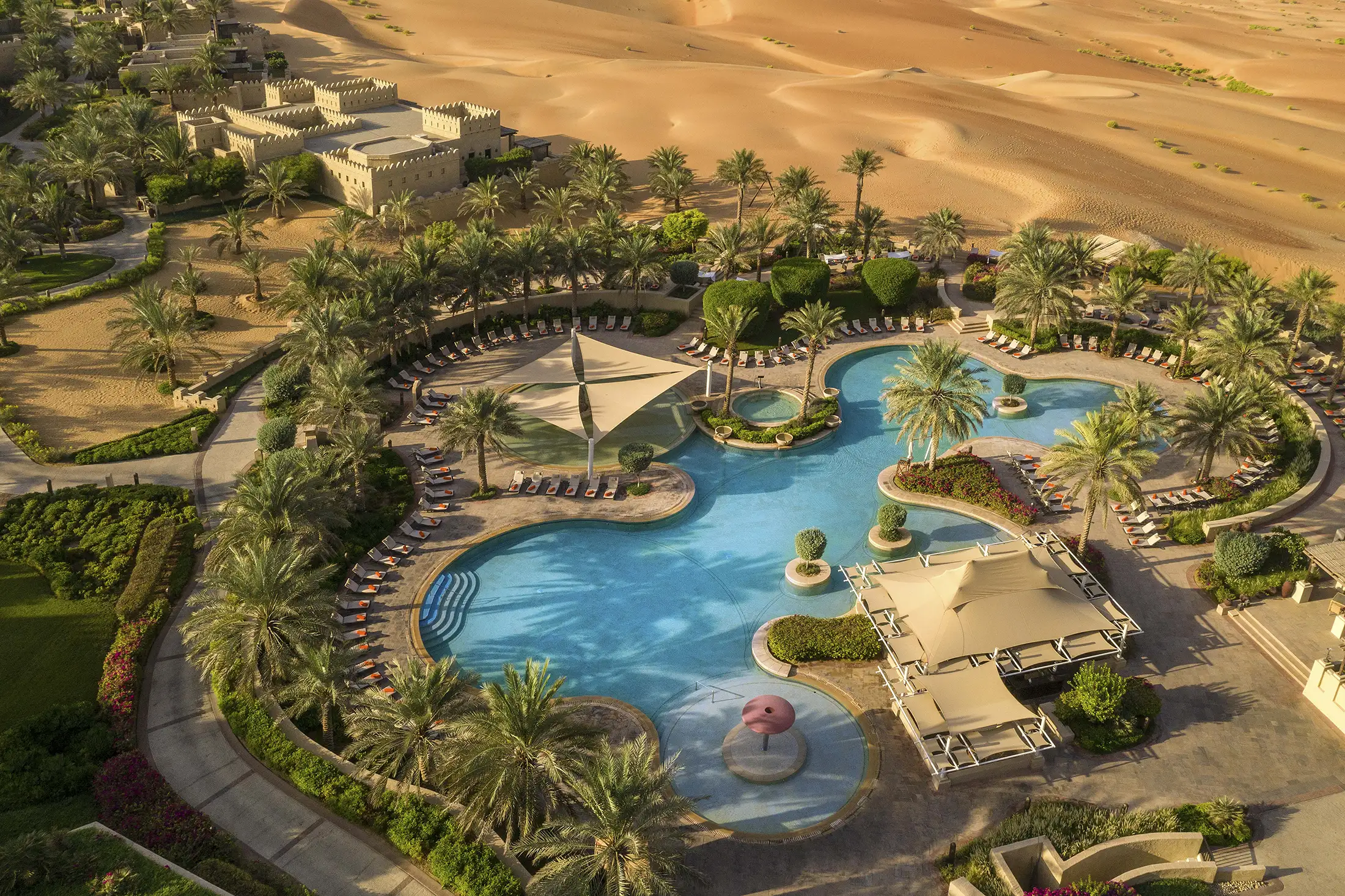 Aerial view of the pool area at Qasr Al Sarab Resort & Spa