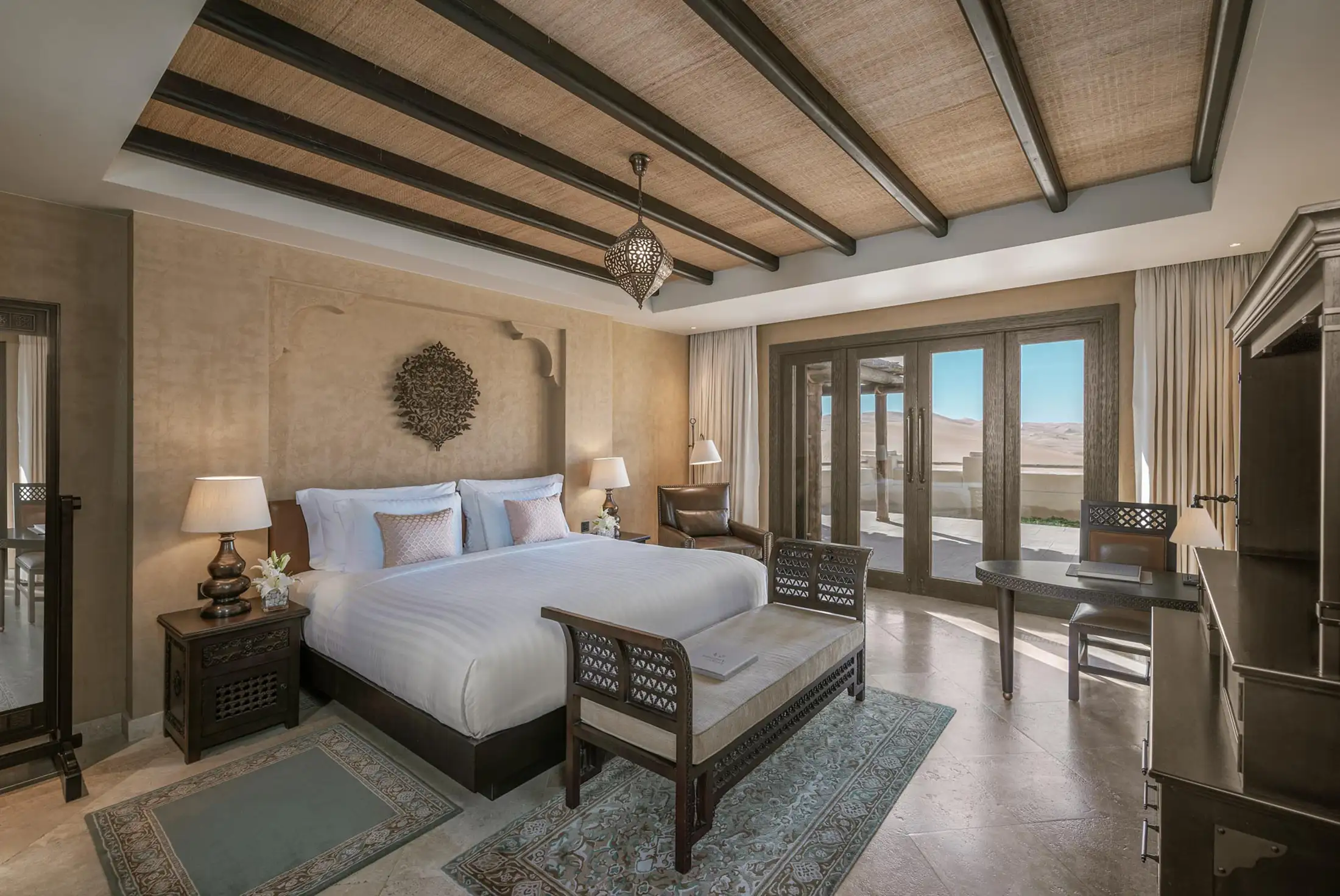 Bedroom interior at Qasr Al Sarab Resort & Spa