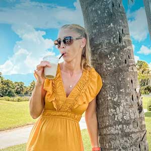 Erin Lockwood sips a drink in Puerto Rico