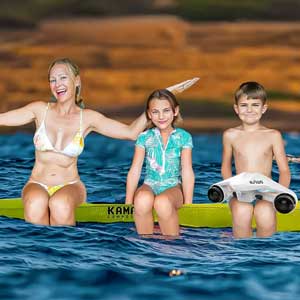 The Lockwood family, sitting on a kayak in the waters off Maui