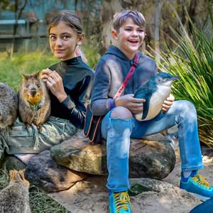 Brooklyn and Colt Lockwood holding exotic animals at a Sydney zoo