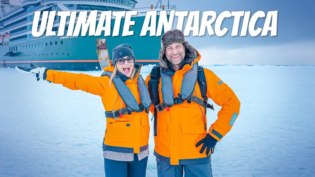 Phil and Erin Lockwood standing on Antarctic ice with a cruise ship in the background