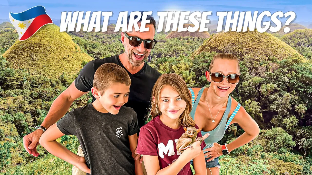 The Lockwood family holds a tarsier in Bohol, Philippines