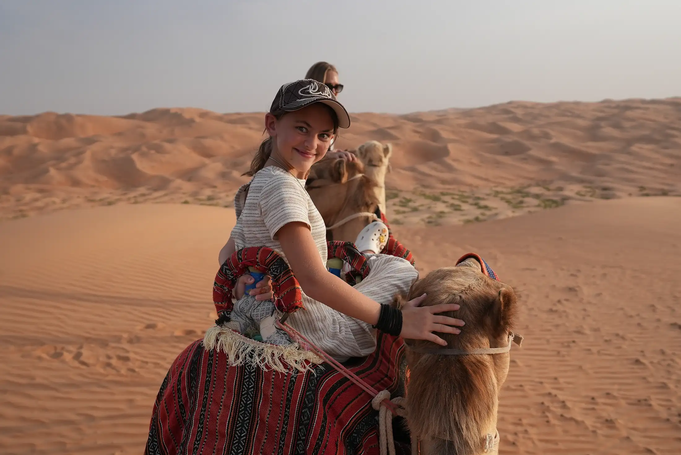 Brooklyn Lockwood makes a funny face while riding a camel through the UAE